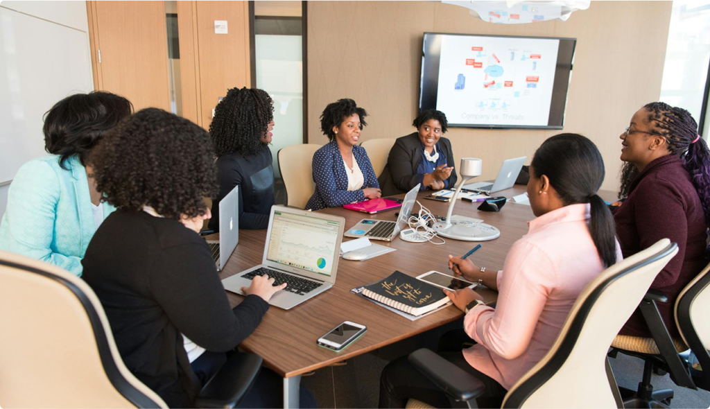 a group of people in a meeting