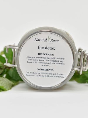 a white product image on a white background with leaves surrounding it
